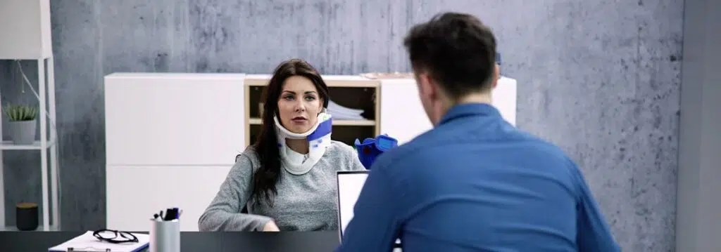 injured women consulting with attorney